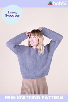 a woman is holding her hands behind her head while wearing a knitted sweater and pleated skirt