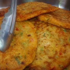 some fried food is being served with a fork