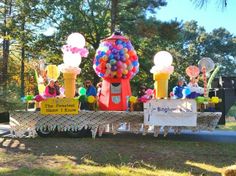 people are riding in a float decorated with balloons