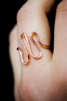 The elegant curves of this design are wave-like, creating a sense of movement and fluidity that is versatile and organic. The ring is handcrafted out of a D-shaped (half round) wire that is then flattened and formed into this three dimensional form. This listing is for ONE single ring in 14K Rose Gold Fill The thickness of the metal used with this ring measures approximately 2mm which gives this piece a durable and sturdy design while maintaining that effortless look. While this ring is gorgeous Elegant Rose Gold Copper Rings, Modern Twist Rose Gold Ring, Minimalist Rose Gold Spiral Jewelry, Minimalist Wire Wrapped Rose Gold Ring, Elegant Spiral Rose Gold Ring, Elegant 14k Gold Wire Wrapped Rings, Minimalist Rose Gold Wire Wrapped Ring, Modern Irregular Shaped Metal Rings, Single Ring