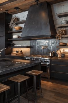 a kitchen with an oven, stove and stools on the counter top in front of it