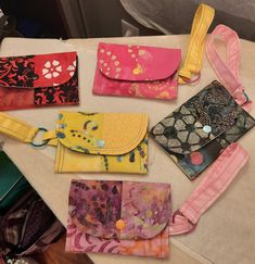 several purses are lined up on a table