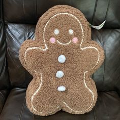 a stuffed ginger sitting on top of a leather chair