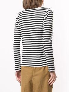 Comme Des Garçons Play Striped logo-patch T-shirt - Farfetch Classic Crew Neck Top With Signature Stripes, Classic Crew Neck Tops With Horizontal Stripes, Black Crew Neck Top With Signature Stripes, Classic Striped Tops With Ribbed Cuffs, Classic Crew Neck Top With Striped Hem, Classic Striped Crew Neck Top, Classic Crew Neck Top With Contrast Stripes, Classic Tops With Striped Collar And Crew Neck, Classic Crew Neck Top With Striped Collar