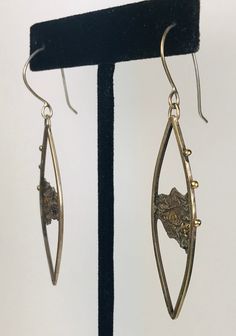 "These handcrafted one-of-a-kind reticulated sterling silver earrings are enhanced with gold using the keomboo technique. Each eating is embellished with gold balls. Lightweight and dramatic. The earrings are 2 1/4\" long and hang from the ear 3/4\" with sterling silver earwires." Frog Eye, The Ear, Eye Necklace, Sterling Silver Earrings, Gold Earrings, Silver Earrings, Dangle Drop Earrings, Handmade Items, Drop Earrings