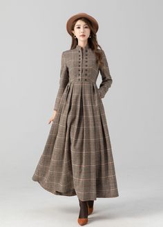 Introducing our plaid ankle-length, long-sleeve wool dress. Whether you're attending a formal event or a casual gathering, this plaid wool dress promises to make a stylish statement while keeping you cozy.  Details: * 35% wool blend, 35% fiber and polyester, 30% nylon * Polyester lining * Two side pockets * Back zipper closure * Long sleeve * Buttons detail on the chest  * Perfect for autumn and winter * Dry clean MODEL SIZE Bust 85 cm(33.4") Waist 67 cm(26.7") Height 168cm (5' 6") She wears siz Long Wool Dress, Winter Wool Dress, Working Dresses, Maxi Dress Winter, Winter Formal Dresses, Cozy Dress, Dresses Casual Winter, Custom Dress, Dress Autumn