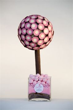 a pink and white ball on top of a table