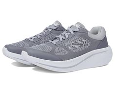 SKECHERS Max Cushioning Essential - 220723 - Men's Shoes : Gray : Make a sporty statment with every step you take wearing SKECHERS Max Cushioning Essential - 220723 Sneakers. Textile and synthetic upper. Textile lining. Cushioned textile insole. Raised round toe. Lace closure. Brand logo on side panel, tongue, and insole. Synthetic outsole. Imported. Measurements: Weight: 9 oz Product measurements were taken using size 9, width D - Medium. Please note that measurements may vary by size. Comfortable Gray Synthetic Running Shoes, Sporty Walking Shoes With Arch Support For Streetwear, Gray Athleisure Sneakers, Comfortable Gray Sneakers For Athleisure, Gray Athletic Fit Walking Shoes For Sports, Sporty Streetwear Running Shoes With Arch Support, Comfortable Gray Athleisure Sneakers, Sporty High-top Walking Shoes With Arch Support, Gray Comfortable Sneakers With Cushioned Footbed