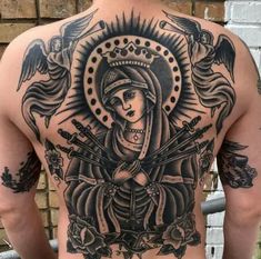 the back of a man's body with tattoos on it and an image of a woman