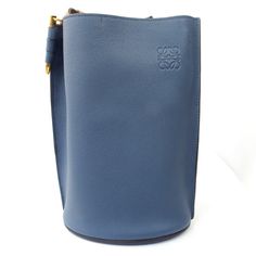 Condition: Brand New; Never Used Size: Width: 11in Height: 7.5in Depth: 5in Drop: 17in Color: Exterior: Blue Interior: Tan Luxury Blue Shoulder Bucket Bag, Luxury Blue Bucket Bag, Designer Blue Bucket Bag With Dust Bag, Designer Blue Bucket Bag, Blue Formal Bucket Bag, Formal Blue Bucket Bag, Designer Blue Bucket Bag For Travel, Blue Bucket Bag For Evening, Blue Luxury Pouch Bucket Bag