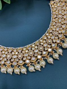 Premium quality tyanni kundan choker necklace, pearl and Monalisa bead work. Pearl lining. Widest part of the necklace is 1.5 inch . comes with matching Chandbali . About 2.25 inch long Mathew Heavy Kundan Choker For Receptions, Kundan Choker With Meenakari For Reception, Kundan Tilla Choker Necklace For Reception, Kundan Meenakari Choker Necklace For Reception, Meenakari Kundan Choker Necklace For Reception, Meenakari Kundan Choker For Reception, Festive Kundan Pearl Choker Necklace, Festive Heavy Kundan Pearl Necklace, Temple Jewelry Kundan Choker For Reception