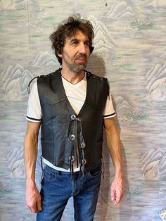 "Vintage Oppened Mens Black Leather Vest Rocker Leather Waistcoat Western Biker Rocker ASPIRIN RIDER Vest Large Size Adjustable Vest Label size: L Estimated size: M - L Measurements: (lying flat) Length - 21,5\" / 55 cm Pit to pit: 22,5\" / 57 cm (adjustable) Waist - 22,5\" / 57 cm (adjustable) Please check measurements to insure a proper fit. Remember to allow yourself some extra room for movement. You can compare these with something from your closet that fits you well. This vest will come to Crocodile Dundee, Bohemian Style Men, Leather Waistcoat, Black Leather Vest, Wingtip Shoes, Brown Leather Shoes, Blue Vests, Mens Vests, Wool Vest