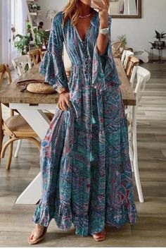 Introducing a remarkable boho dress with a V-neck and a beautiful floral print. This dress not only exhibits excellent quality but also offers breathable, sweat-absorbent, and comfortable wear. Its unique and chic design adds an elegant touch to your appearance. Printed V-neck Boho Dress For Festivals, Hippie V-neck Free Size Maxi Dress, Bohemian V-neck Maxi Dress With Floral Print, Bohemian V-neck Floral Print Maxi Dress, Bohemian V-neck Maxi Dress For Beach Season, Bohemian Patterned Maxi Dress With Boho Print, Multicolor Printed Bohemian Boho Dress, Multicolor Printed Bohemian Dress, Casual Flowy Printed Boho Dress