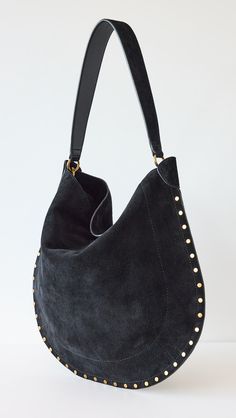 Find ISABEL MARANT ÉTOILE Oskan Hobo Soft Bag on Editorialist. Calfskin suede. Whipstitch trim. Matching zip pouch included. Magnetic snap. Textile lining. Weight: 24oz / 0.68kg. Imported, Tunisia. Measurements: Height: 15.25in / 39cm Length: 17.25in / 44cm Handle drop: 4.25in / 11cm Suede Shoulder Bag With Gold-tone Hardware, Chic Suede Bucket Bag With Removable Pouch, Chic Suede Hobo Bag, Chic Suede Hobo Bag With Leather Handles, Designer Suede Shoulder Bag With Gold-tone Hardware, Chic Hobo Bag With Leather Trim For Daily Use, Chic Suede Hobo Bag With Removable Pouch, Chic Suede Bucket Bag With Suede Lining, Chic Suede Hobo Bag For Everyday