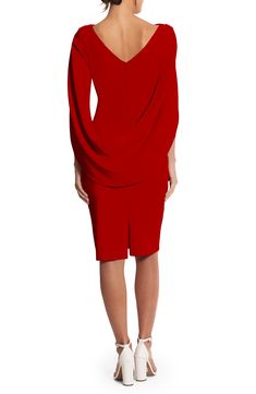 A cocktail dress made of stretchy, asymmetrically draped crepe features cape sleeves that encourage you to embellish every story with a dramatic flourish. 41" length (size 8) Hidden back-zip closure Bateau neck Cape sleeves Lined 94% polyester, 6% spandex Dry clean Made in the USA of imported fabric Red Evening Dress With Draped Sleeves, Red Fitted Dress With Cape Sleeves, Elegant Red Elastane Bodycon Dress, Elegant Red Bodycon Dress With Elastane, Evening Bodycon Dress With Draped Sleeves, Elegant Red Bodycon Dress With Asymmetrical Neckline, Chic Cocktail Dress, Cape Sleeves, Bateau Neck