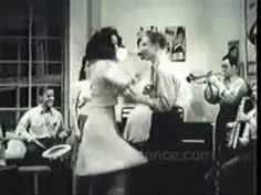 an old black and white photo of people in a living room playing musical instruments together