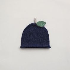 "Handmade from 100% baby alpaca, this cute blueberry hat will keep your little one cosy during cooler months.    Beautifully soft and lightweight, this knitted beanie in berry design will add the perfect finishing touch to your baby's outfit. Can be paired with our knitted booties.  Each hat is hand-knitted with love and care by my lovely mother and a grandmother of three. This alpaca hat is a truly special gift for welcoming a new baby in your life.   Baby alpaca fibre is ideal for baby's sensi Blue Knit Beanie Hat, Blue Knit Beanie, Blue Knitted Cap Beanie, Blue Knitted Beanie Cap, Playful Blue Hat For Gift, Cozy Blue Knit Hat, Blue Soft Knit Hat, Cute Blue Knitted Hat, Blue Hand Knitted Beanie Bonnet