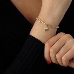 "This 14k Gold Bracelet is excellent for daily wear to have an elegant look. It may be adjusted to your size using the rolo rings itself. It also has double chain which is quite popular nowadays. With this bracelet, you will carry one of the stars you count every night. ◖ P R O P E R T I E S ◗ * Material: 14k Yellow Gold, 14k White Gold * Weight: 2.8gram (for 7\", without charm) * Weight: 3.5gram (for 7\", with charm) ◖ D I O N J E W E L ◗ ‣ 14K REAL GOLD ‣ EXPRESS DELIVERY IN 1-3 DAYS* ‣ HANDMA Metal Star-shaped Bracelets, Star Jewelry With Lobster Clasp, Dainty Star Charm Bracelet, Gold Chain Bracelet With Star Charm, Gift Chain Bracelet With Star Charm, Gold Star Charm Chain Bracelet, Metal Chain Bracelet With Star Charm As Gift, Gold Star Chain Bracelet As Gift, Paperclip Bracelet