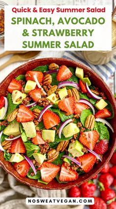 strawberry salad with spinach, avocado and strawberries in a bowl