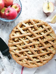 an apple pie sitting on top of a table