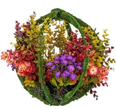 a basket filled with lots of colorful flowers