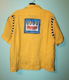 Vintage Deadstock Hamm's Beer Bowling shirt. Rockabilly bowling fun. Rare beer novelty shirt. Features: rayon cotton blend, embroidered "Bob" and "Northwest Beer Dist." on front, large Hamm's patch on back, smaller Hamm's patch on sleeve, one front pocket, shirt jac style.  Tag: The Stretch - Jac Service Bowling Shirt Washable Use No Bleach 15-15 1/2 Sleeves 9" Chest 46" Shoulders: 17.5" Length: 25.5" Excellent unused condition. Midcentury Modern Shirts, 1950s Shirts, Hamms Beer, Inktober 2024, Bowling Shirt, Novelty Shirts, Bowling Shirts, Pocket Shirt, Mens Oxfords