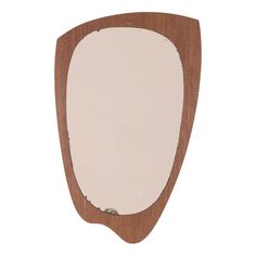 a wooden mirror with white paint on it's edges and an oval shape in the middle