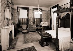 an old fashioned bedroom is shown in black and white