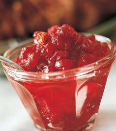 a small glass bowl filled with cranberry sauce