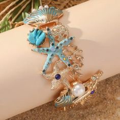 Ocean Beach Shell Wrist Or Ankle Bracelet. New Adjustable. Made With: Alloy, Rhinestones, Pearls. Toggle Clasp. Size: 8.25 Inches In Length. Adjustable Blue Jewelry For Vacation, Summer Bracelets With Starfish Charm, Trendy Turquoise Jewelry For The Beach, Trendy Turquoise Beach Jewelry, Summer Blue Shell Jewelry, Summer Vacation Starfish Jewelry, Starfish Charm Bracelets For Beach Season, Vacation Bracelet With Starfish Charm, Summer Metal Beaded Bracelets