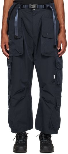 Polyester taffeta cargo pants. Cargo pockets and loops throughout. · Detachable hook-eye strap at partially elasticized waistband · Integrated magnetic belt · Four-pocket styling · Zip-fly · Logo flag at front · Detachable patch pocket at outseams · Pleats at inseams Supplier color: Navy Nylon Techwear Cargo Pants With Belt Loops, Functional Nylon Cargo Pants With Belt Loops, Techwear Nylon Pants With Belt Loops, Urban Parachute Pants With Belt Loops For Outdoor, Urban Parachute Pants For Outdoor With Belt Loops, Nylon Parachute Pants With Belt Loops For Streetwear, Functional Parachute Pants With Belt Loops For Outdoor, Functional Nylon Pants With Belt Loops, Techwear Cargo Pants For Outdoor Activities