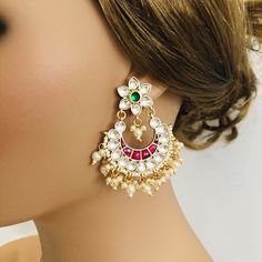 Beautiful and Unique Style Affordable Luxury traditional Bollywood Chandbali earrings with Kundan stones and Colored ruby semi precious Stones. 22k gold plated jewelry Length: 2.25 Inches Click here to see the complete collection of Kundan and Polki Statement Earrings at AryaFashions: https://www.etsy.com/shop/AryaFashions?section_id=25872820 Follow us on social media for new and latest designs: Facebook: www.facebook.com/shoparyafashions Pinterest: www.pinterest.com/aryafashions Instagram: www. Ceremonial Chandbali Earrings With Latkans, White Meenakari Chandbalis For Celebration, Bollywood Style Chandbalis For Ceremonial Occasions, Ceremonial Chandbali Earrings With Tilla, White Kundan Chandbalis For Ceremonial Occasions, Heavy Chandbali Bridal Earrings For Ceremonial Occasions, Festive White Chandbali Earrings, Traditional White Meenakari Chandelier Earrings, Multicolor Chandbalis With Zari Work For Wedding