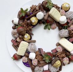 a white plate topped with lots of different types of desserts