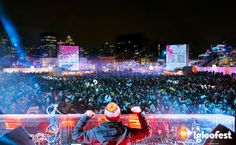 a dj performing in front of a large crowd