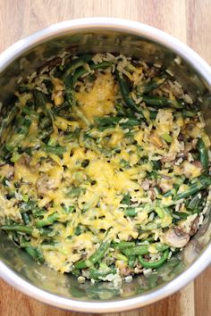 a pot filled with green beans and cheese