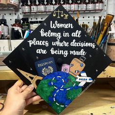 someone is holding up a graduation cap that says women belong in all places where decision are being made