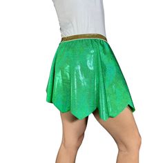 These fun sparkle fairy costumes are flattering and functional! Designed with the Tinkerbell Run in mind.Each skirt has an elastic waist and an A-Line design maximum comfort while running. They are very light weight and you won't even notice you're wearing one. This skirt is made in a green sparkle spandex with a metallic gold elastic waistband and scalloped on the lower edge.These skirts do not include under shorts. Be sure to wear your favorite spandex or booty shorts under. Stretch Mini Skirt For Cosplay, Fitted Green Skirt With Elastic Waistband, Stretch Mini Skirt For Costume Party, Green Skirt With Elastic Stretch Waistband, Fitted Party Skort With Elastic Waistband, Stretch Skirt For Costume Party, Tinkerbell Fairy, Fairy Costumes, Running Skirt