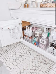 the bathroom is organized and ready to be used as a storage area for personal care items