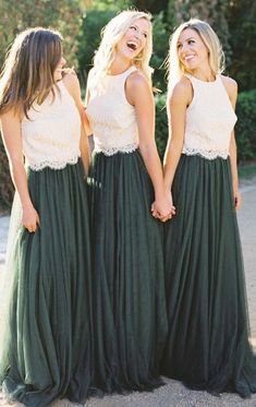 three women in long green dresses standing next to each other with their hands on their hips