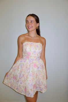 Our 'Isabella' mini dress features a A-line silhouette, strapless neckline, includes cinched belted bow front waist, and allover pink floral detailing. Model is wearing a small. Fits true to size! Size Recommendations 0-4:S, 6:M, 8-10:L All Love <3 Formal Short Dress, Dresses For Dances, Nyc Outfits, Katie May, Eighth Grade, Formal Dresses Short, Strapless Neckline, Clothes Aesthetic, 15th Birthday