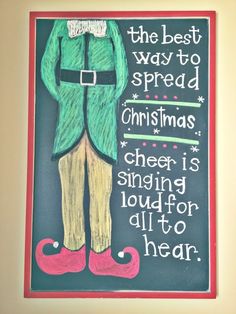 a chalk board with an elf saying the best way to spread christmas cheer is singing loud for all to hear