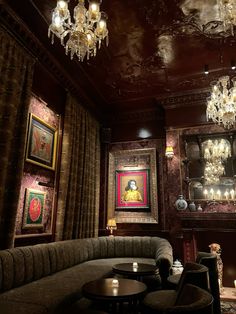 a living room filled with furniture and chandeliers