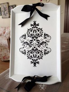 a white box with a black bow on it