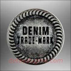 an old metal baseball with the word denim trade mark on it