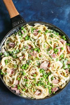 pasta with peas and ham in a skillet