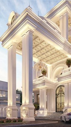 a car is parked in front of a large white building with columns and chandeliers