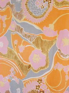 an orange and pink fabric with flowers on it