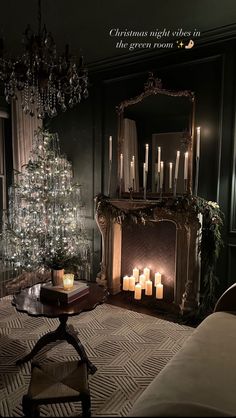 a living room with a christmas tree and lit candles