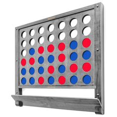 a giant four in a row game with red, white and blue dots on it