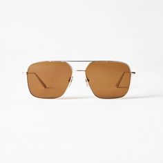 Bold Minimalism Defines Aviator, A Contemporary Take On The Classic Rectangular Silhouette. The Lightweight Frame Is Handcrafted In Shiny Stainless Steel With Slim Cylinder- Shaped Temples And Finished With A Brow Bar. Fitted With Uv-Protective Lenses. Each Pair Comes With A Branded Case, Pouch And Cleaning Cloth Brown Lenses Gold Metal Everything Included Comes With It. Worn Two Or Three Times. Classic Square Frame Aviator Sunglasses For Summer, Classic Glass Aviator Sunglasses For Summer, Modern Aviator Sunglasses For Summer, Classic Rimless Sunglasses For Summer, Modern Summer Aviator Sunglasses, Minimalist Summer Sunglasses With Tinted Lenses, Minimalist Everyday Sunglasses For Summer, Minimalist Tinted Sunglasses For Summer, Classic Rimless Aviator Sunglasses For Summer